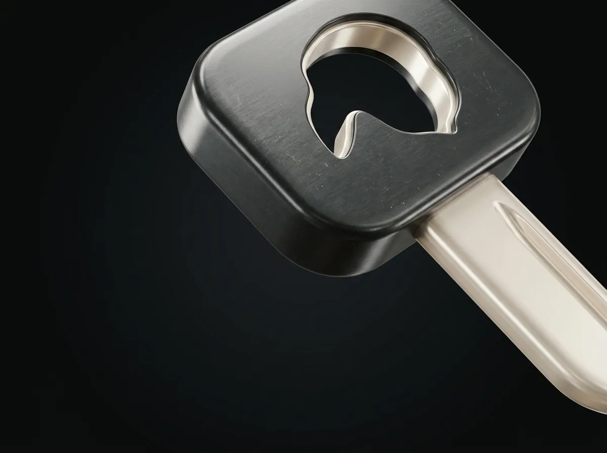 An oversized key whose bow is pierced with the Phantom mask silhouette.